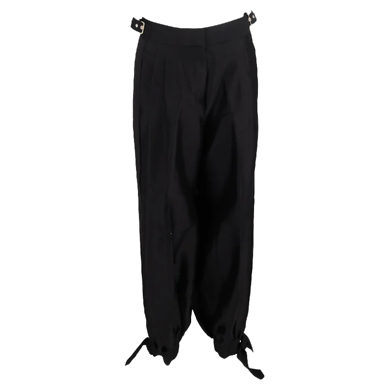 women's distressed denim pantsZimmermann Pleated High-Waist with Buckle Detail Harem Trousers in Black Wool